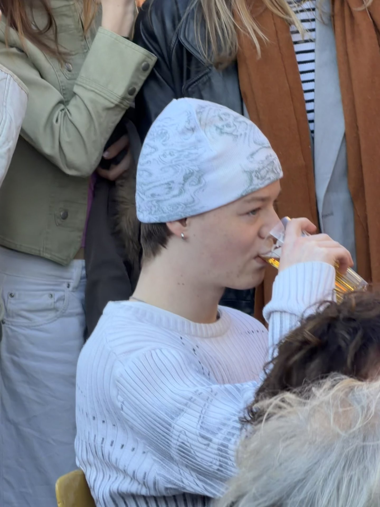 A group of people are enjoying a casual afternoon outdoors in Nieuwmarktbuurt, Amsterdam